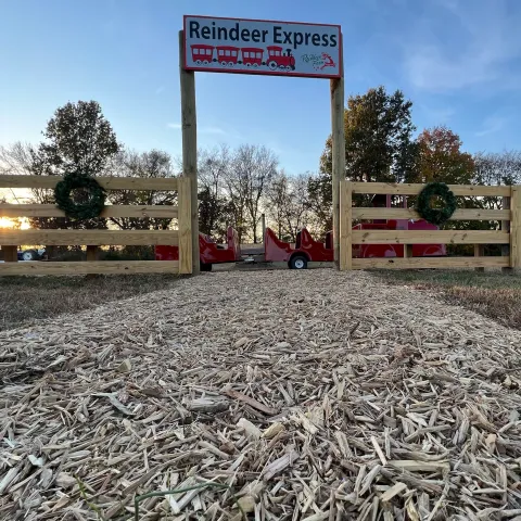 a sign on a dirt road